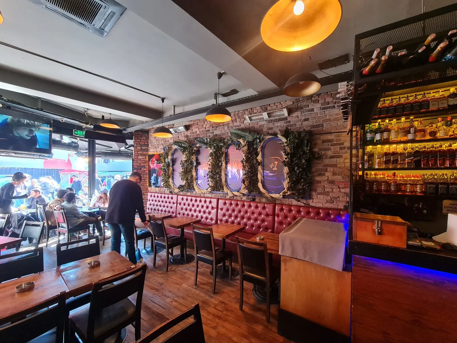 Brand Environment — Bar interiors, façades and lighting, as installed.